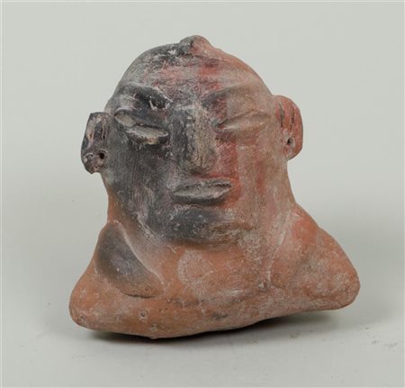 A Colombian Tlatilco bust, circa 1500 BC.12 x 11 cm.