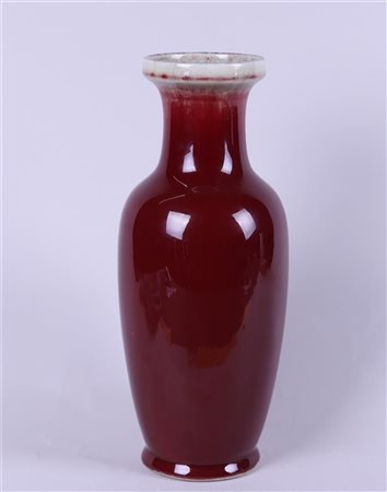 A porcelain Sang de boeuf vase, marked on the bottom. China, 20th century.H....