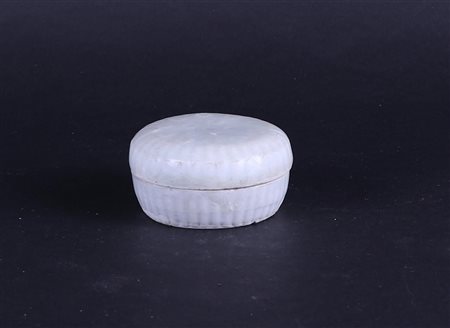 A Quinbay lidded box with relief decoration. Song China 960-1279 or...