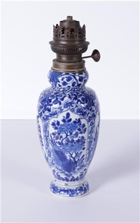 A porcelain baluster vase with floral decor. China, Kangxi. converted into an...