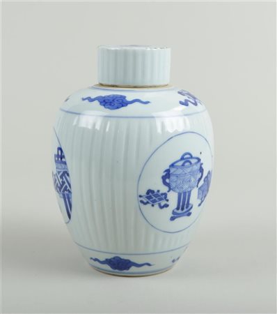 A large ribbed porcelain tea caddy decorated with antiquities in medallions...
