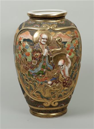 A large Satsuma vase with various figures in relief. Japan, end of the Meiji...