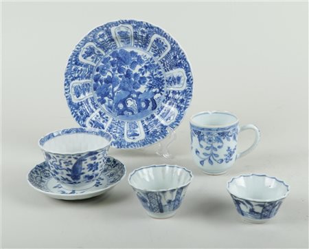 A lot of various cups and saucers, with a plate. All with floral decoration....