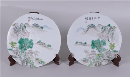 A set of two porcelain plaques with landscape decor and Chinese texts. China,...
