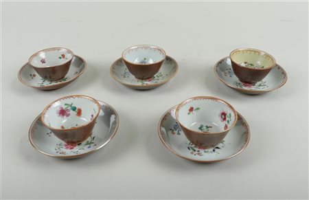 Five porcelain Famille Rose cups and saucers with capuchin exterior. China,...