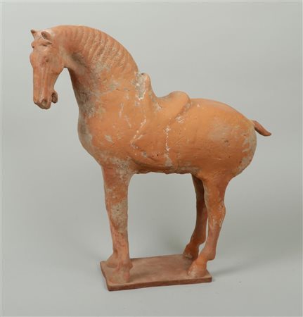 A terracotta 'Tang' statue of a horse, China 618-906 AD.47 x 40 cm.