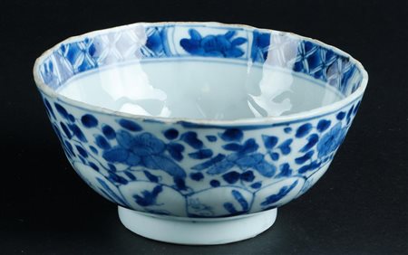 A porcelain bowl with bedding decor with rabbit and floral decor. Marked with...