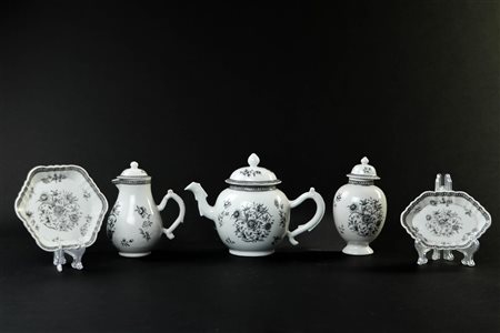 An Encre de Chine tableware set consisting of a teapot, milk jug, tea caddy,...
