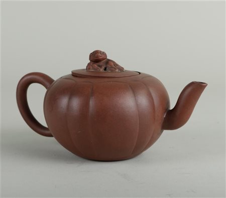 A lobed Yixing teapot with fantasy animal on lid, marked on the inside of the...