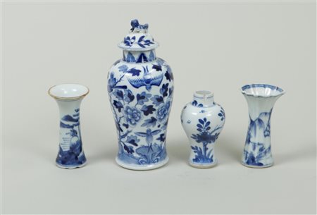 A set of three porcelain Kangxi vases with floral decorations, including a...