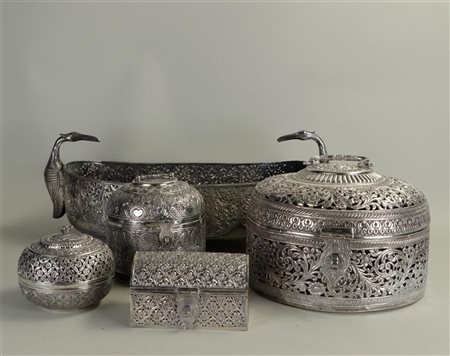 A collection of objects made of silver in Djokja, consisting of a jardinaire...