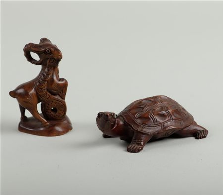 A set of two palmwood netsuke's in the shape of a turtle and a ram. Japan,...