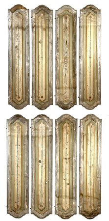 Gruppo di otto scuri in legno sagomato e dipinto con tracce di policromia. Seco