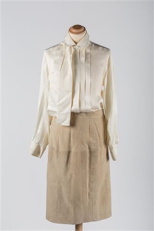 Gucci 1980'sAn outfit consisting of a cream-coloured silk blouse and...
