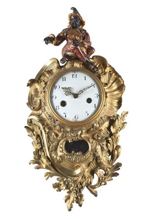 BALTHAZAR
Orologio da parete del tipo Cartel d'applique in bronzo dorato e lacc
