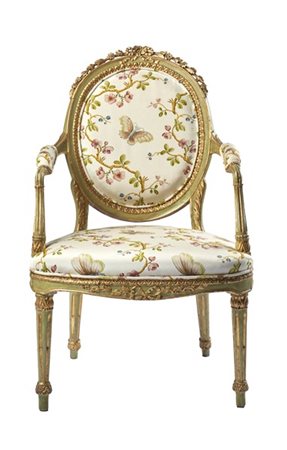 Poltrona in legno intagliato, laccato e dorato, schienale ovale sormontato da n