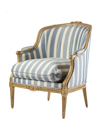 Bergere in legno intagliato e dorato con decoro a foglie, schienale e fascia ce