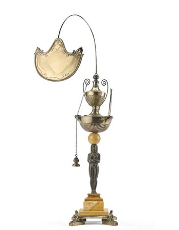 Lucerna in argento con sostegno a figura egizia in bronzo brunito su base gradi