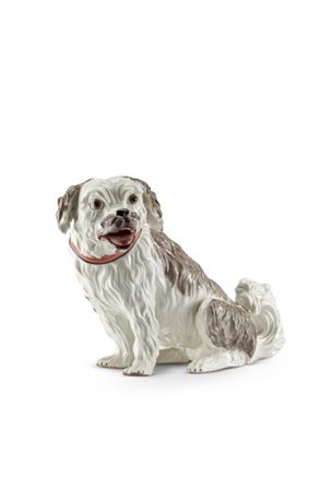 Manifattura francese, secolo XIX. Figura di cane in porcellana dipinta in polic