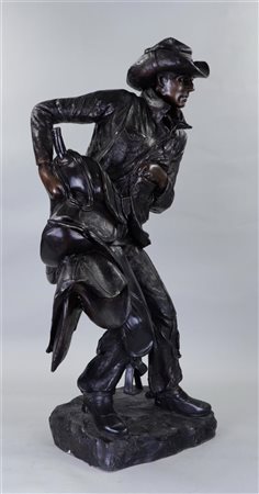 To Frederic Remington (1861-1909). A large patinated bronze statue of a...