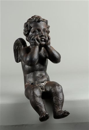 A bronze angel with remains of polychrome. 19th century.H. 33 cm.