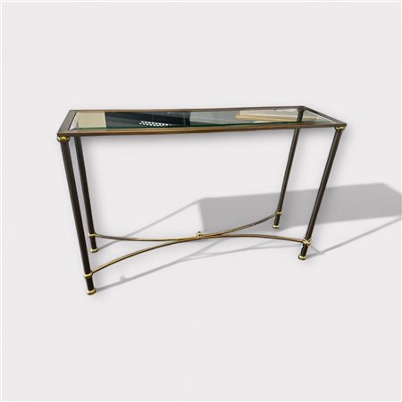 A bronzed metal side table with a facet cut glass top.110 x 70 cm.