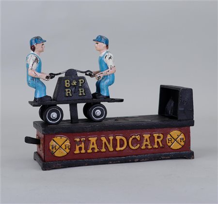 A mechanical cast iron money box 'Railroad handcar bank'.