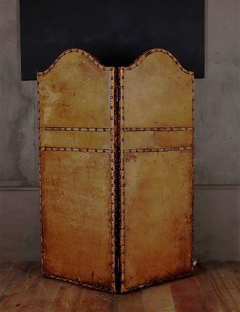 A small, leather-covered, two-part room divider, early 20th century. Height...