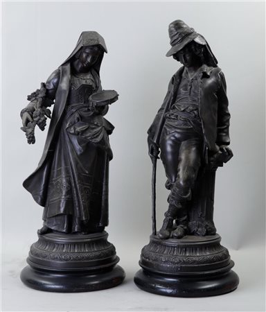 A set of antique zamac figures on a wooden base. H. 40 cm.