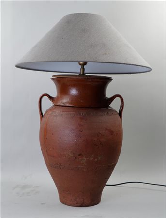 An antique earthenware amphora vase transformed into a table lamp. H. 70 cm.