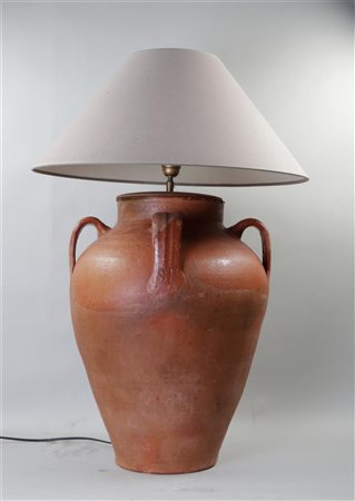 An antique earthenware amphora vase transformed into a table lamp. H. 80 cm.