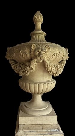 A terracotta garden vase with flower garlands and lion heads, England. 121 x...