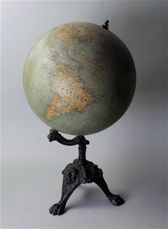 A vintage globe on a bronze base. H. 60 cm.