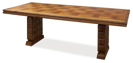 BUFFA PAOLO Importante tavolo allungabile in legno di noce, gambe con decoro...