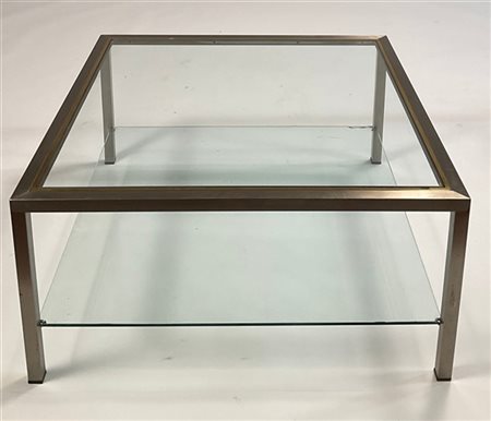 Due tavoli bassi in acciaio aisi e metallo ottonato. Piani in vetro. Italia, an