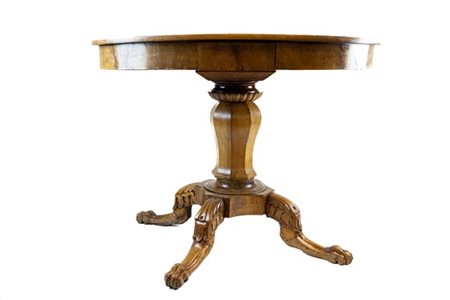 Tavolo con piano circolare in legni vari con due cassetti nella fascia, sostegn