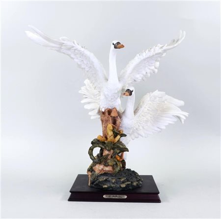 A resin moulding of flying swans. Italy. 20th century.H.: 47 cm.