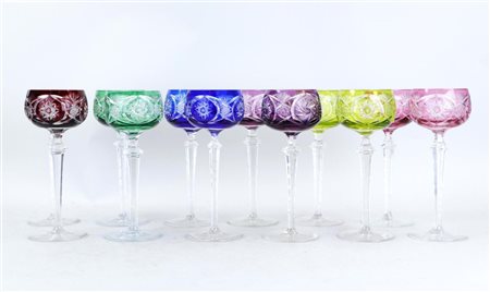 A lot of twelve Bohemian colored crystal wine glasses. Circa 1900.H. 21 cm.