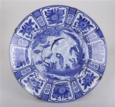 A capital Japanese blue and white Arita dish after Cornelis Pronk, 'The...