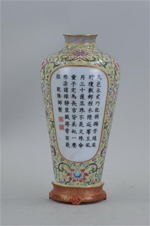 A porcelain famile rose wall vase decorated with Chinese text, marked on the...