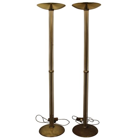 Coppia piantane Ottone e materiale plastico. Secolo XX. Cm h 177