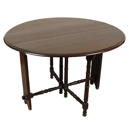 Tavolo a bandelle Rovere. Secolo XX. Cm d 114 h 77