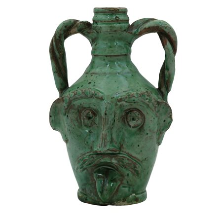 Piccola fiasca antropomorfa Antica maiolica decorata su fondo verde....