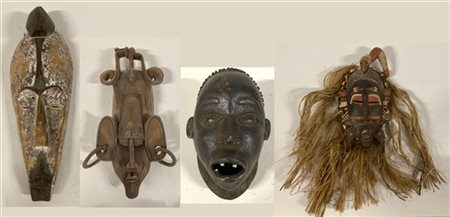 Arte Africana. Lotto composto da quattro maschere (h. cm 45) (difetti)