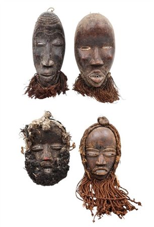 Arte Africana. Lotto composto da quattro maschere Dan barbute in legno intaglia