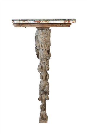 Antica mensola con sostegno in legno intagliato a mascherone su volute fogliace