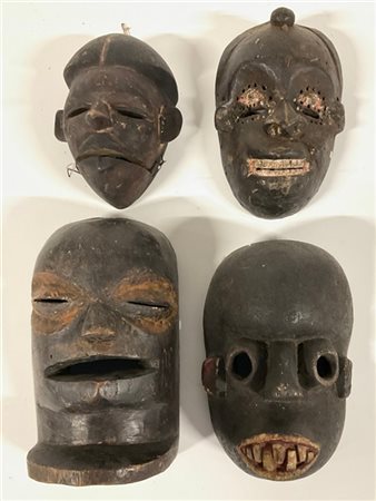 Arte Africana. Lotto composto da quattro antiche maschere (h. max cm 25) (difet