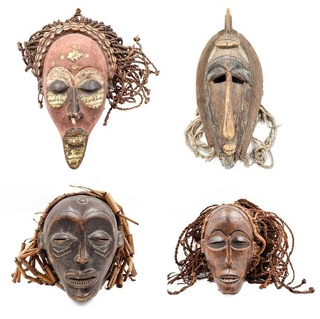 Arte africana. Gruppo di quattro diverse maschere in legno scolpito, parzialmen