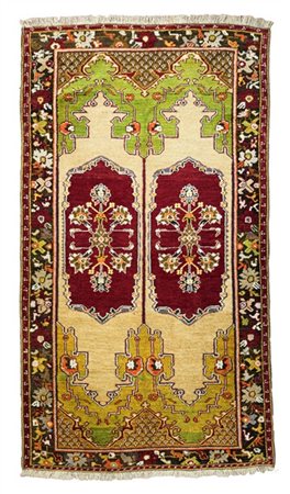 Tappeto Mudjiur, Anatolia, fine secolo XIX. Decoro a doppia preghiera speculare