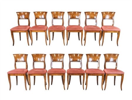*Gruppo di dodici sedie in legno, schienale di forma sagomata con fascia inferi